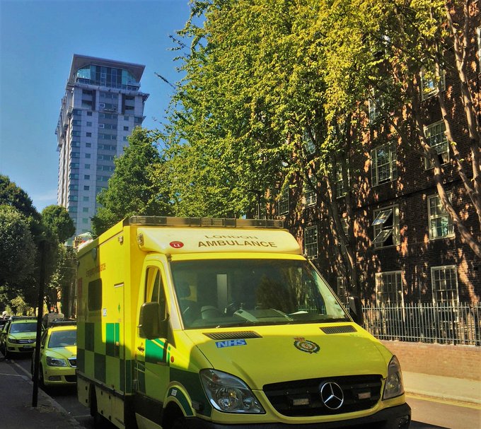 An ambulance in the sunlight with blue skies in background
