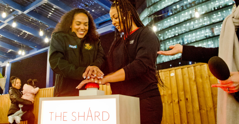 Siobhan and Shivaun smiling as they prepare to switch the lights on