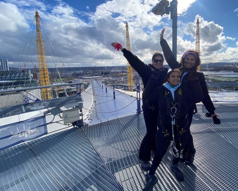 Image shows Shonagh and her two children Kiki and Aaliyah at the top of the O2 dome with the sun shining.