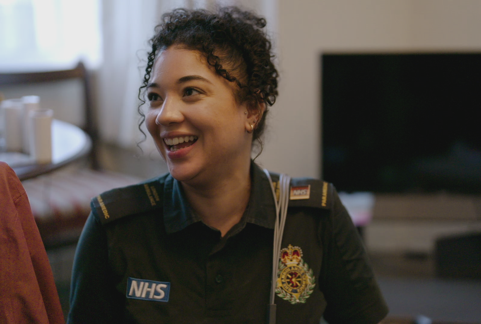 Shyr-Nai in her uniform at the home of patient.