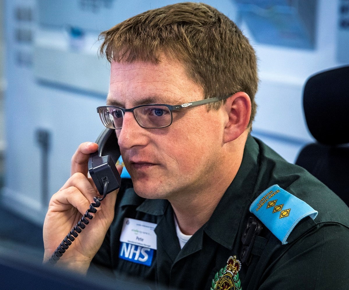 Pete answering a call in the Tactical Operations Centre.