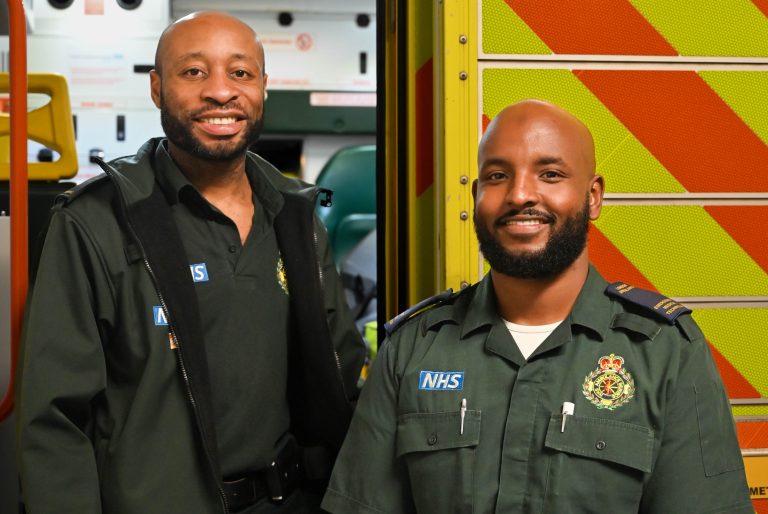 Paramedics stood outside of an Ambulance