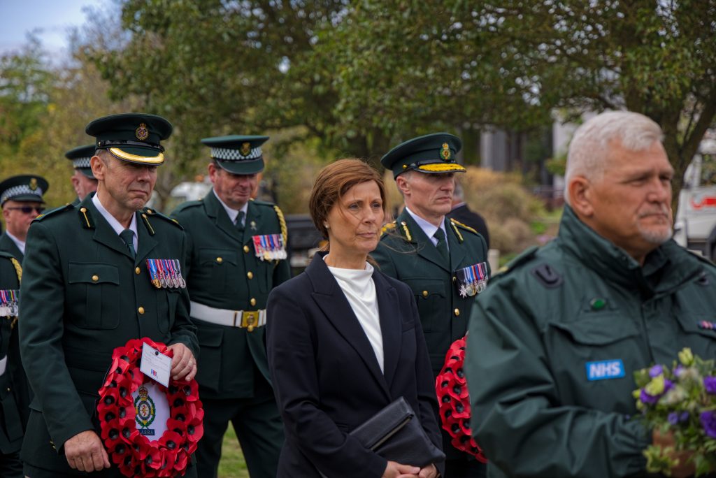 London Ambulance CEO Jason Killens holding a wreath at TASC Memorial