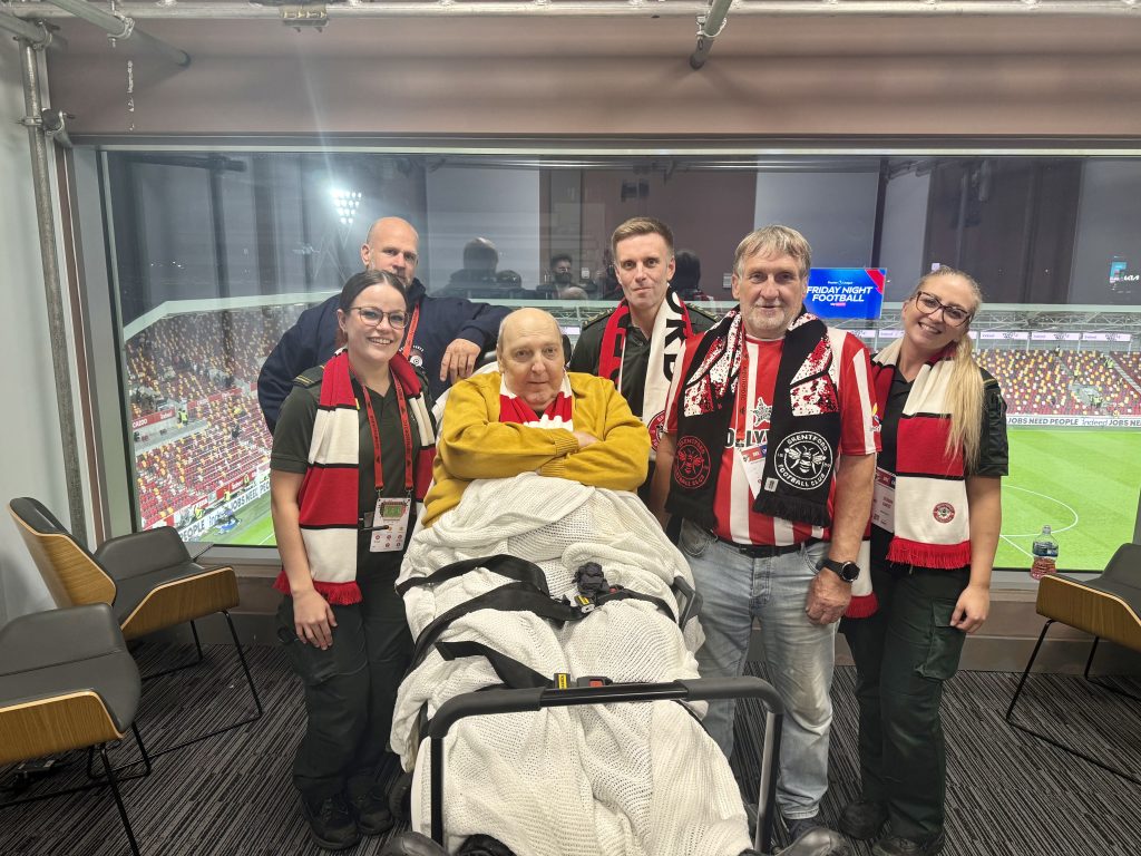 Paul with paramedic crews that transported him to Brentford and friends