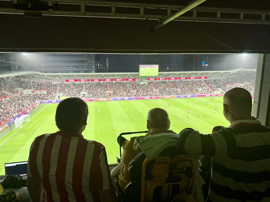 Paul and friends watching Brentford play from a private box